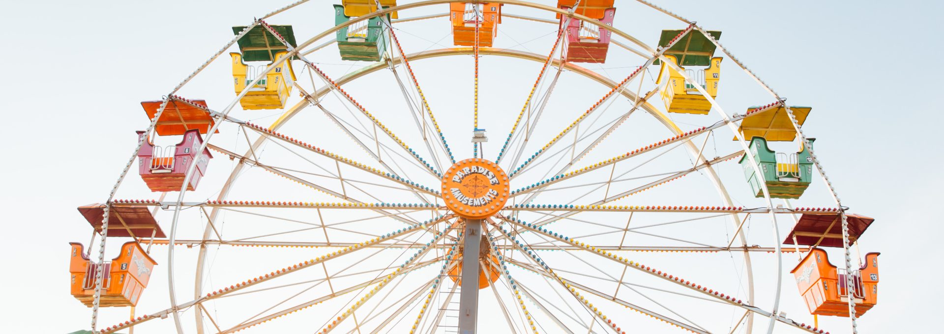 worm's eye view of red, orange, and yellow Ferris wheel